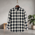 Check shirt in navy and white plaid with button-up front and long sleeves