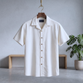 White short-sleeve button-up shirt with pointed collar and front buttons