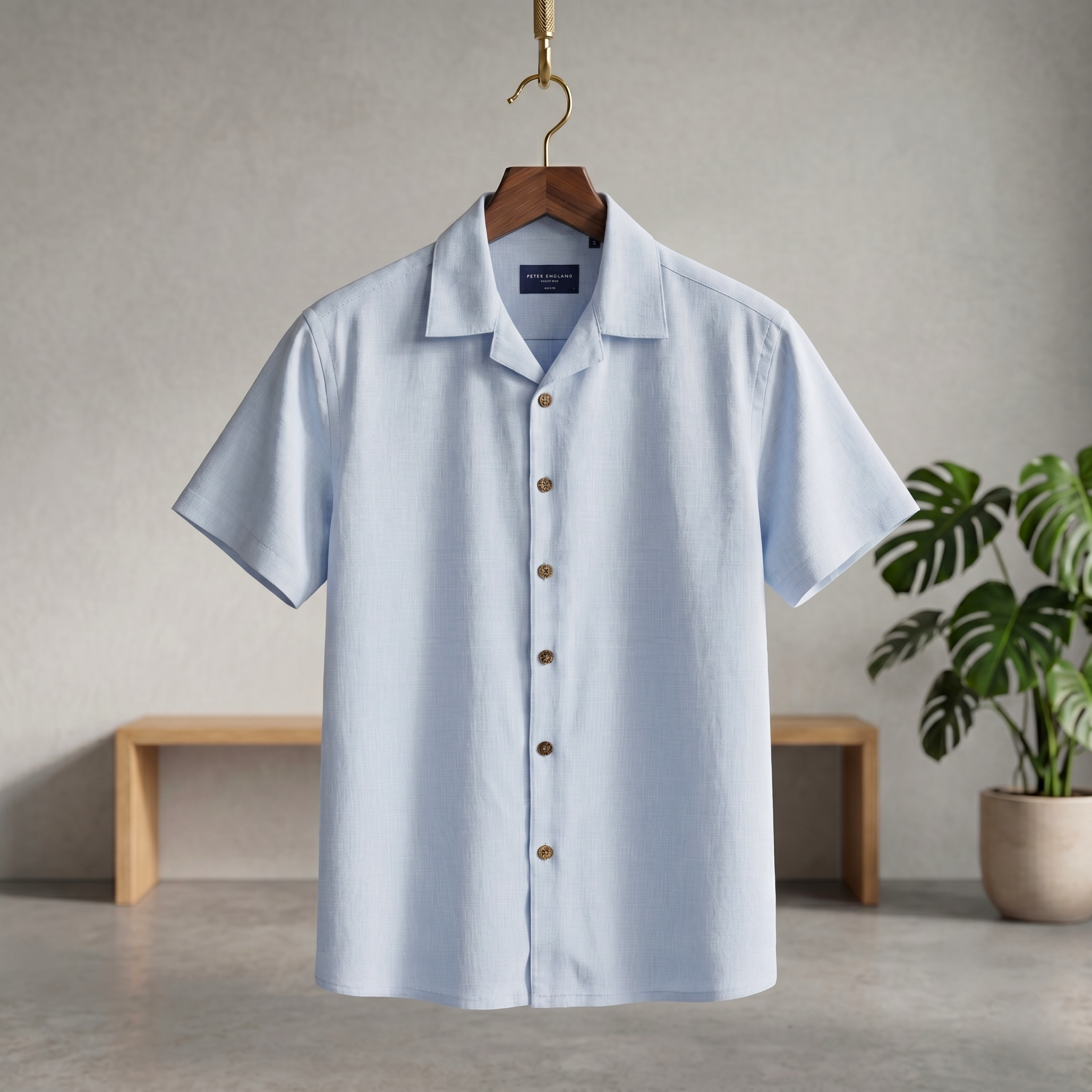 Light blue Cuban-style short-sleeve button-up shirt with pointed collar