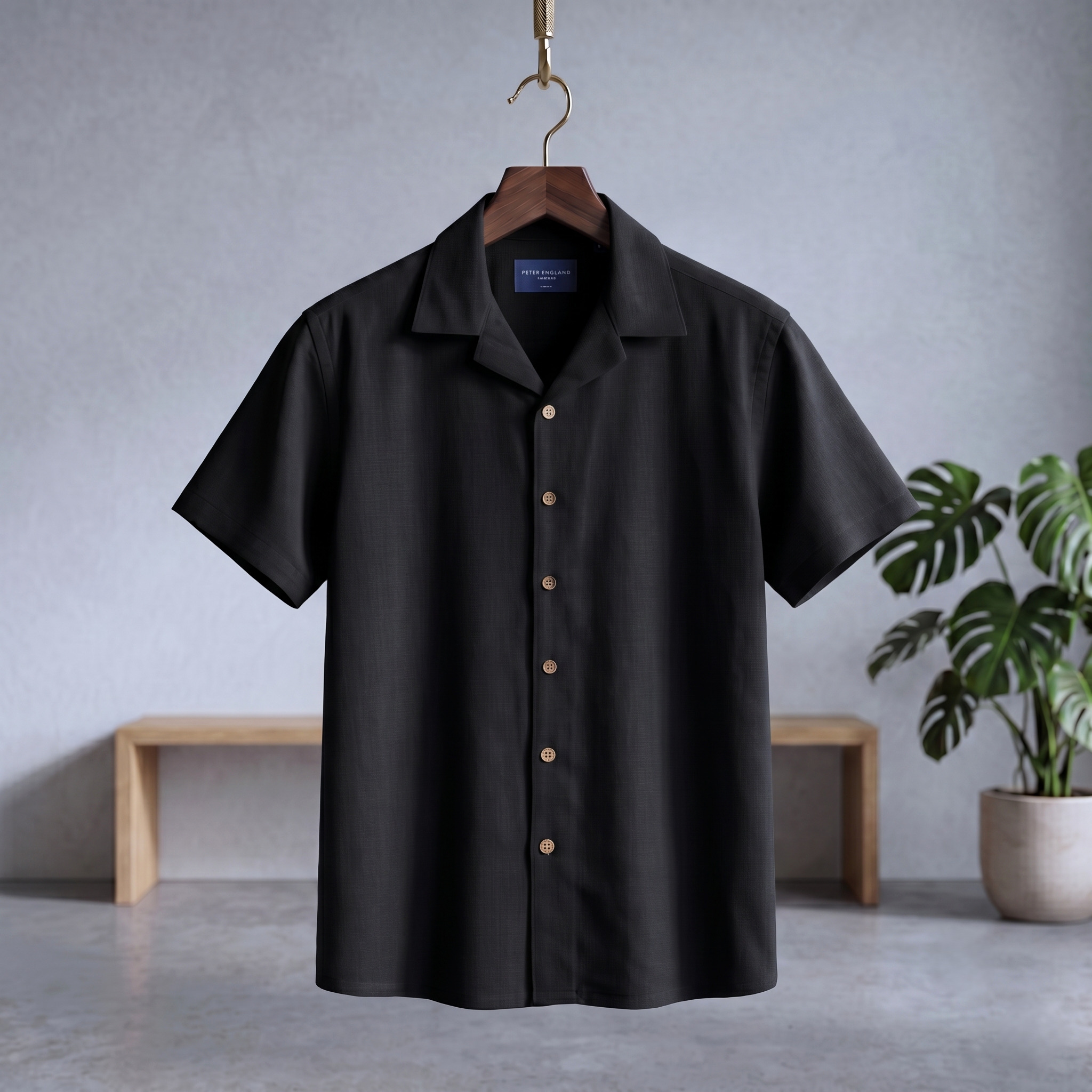 Black Cuban half shirt with short sleeves, open collar, and button-front placket.