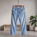 Light blue denim jeans with button fly and five-pocket styling, straight legs