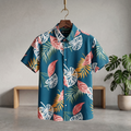 Teal Hawaiian half shirt with colorful tropical leaf and flower print, button front