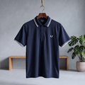Midnight indigo polo shirt with striped collar, button placket, and small chest logo