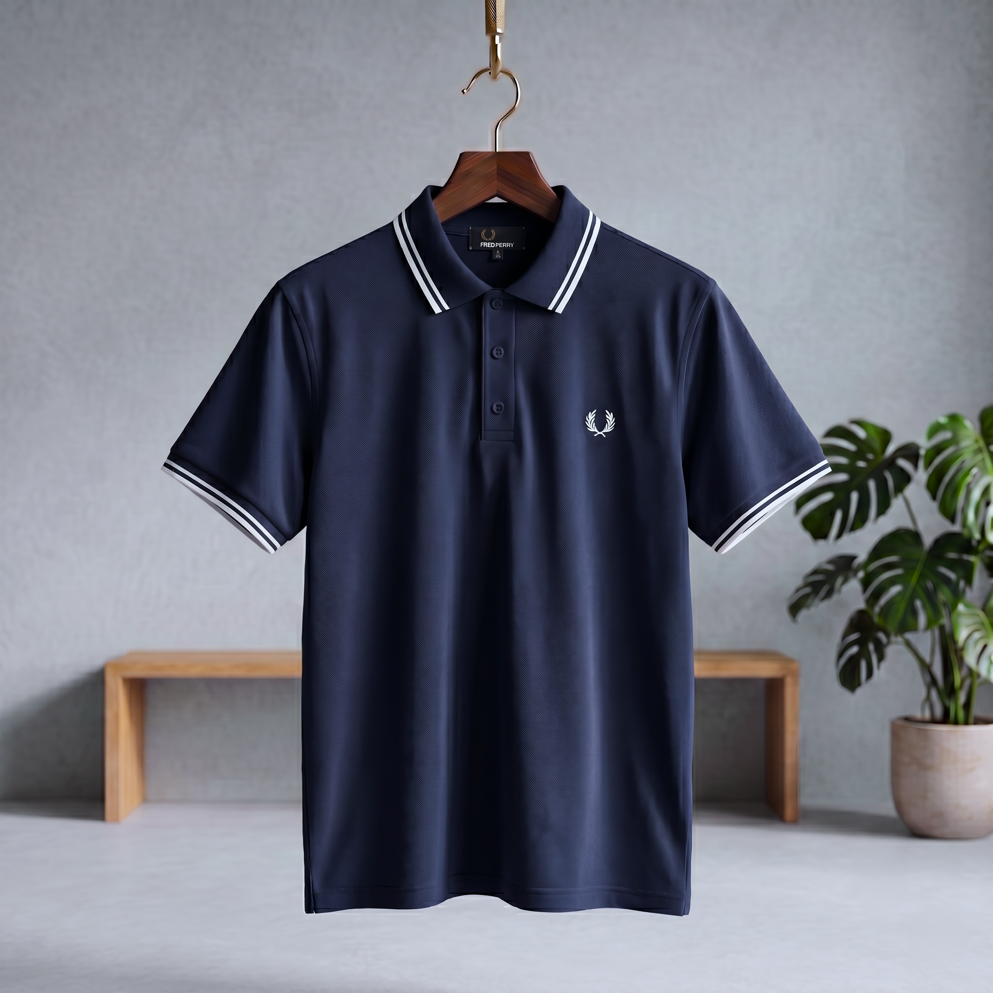 Midnight indigo polo shirt with striped collar, button placket, and small chest logo