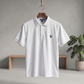 White polo T-shirt with button placket, short sleeves, and small chest logo