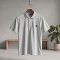 Ash polo T-shirt with short sleeves, button placket, and small embroidered logo