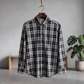 Plaid casual button-up shirt with single chest pocket, dark and white tones