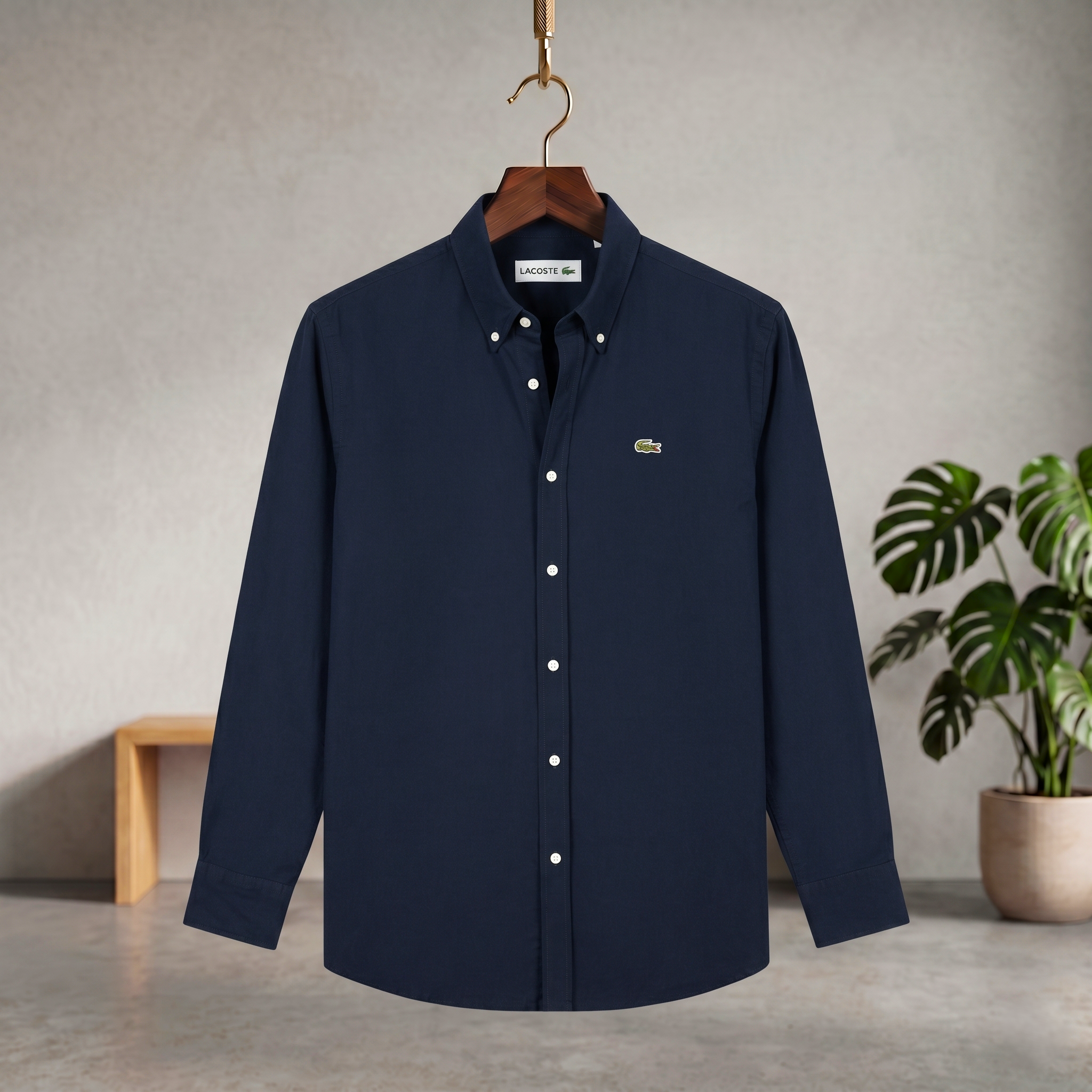 Navy blue solid button-up shirt with small chest logo and long sleeves